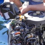 Man pouring and refueling engine motor oil into the engine of a boat, ensuring proper maintenance and performance