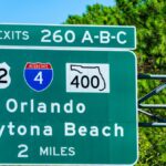 A green Florida highway sign for exits 260 A-B-C for inter- and intrastate highways toward Orlando and Daytona Beach.