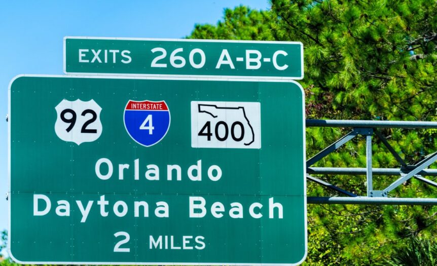 A green Florida highway sign for exits 260 A-B-C for inter- and intrastate highways toward Orlando and Daytona Beach.