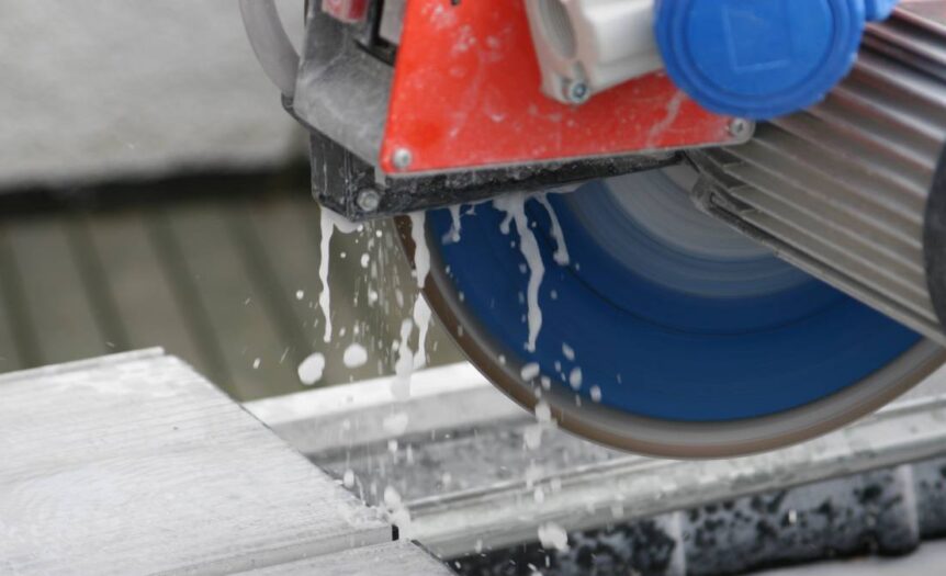 A blade saw in active operation with the blade about to cut through tiling for a precise cut and job accuracy.