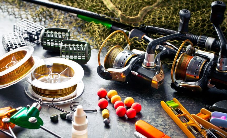 A variety of fishing accessories, including fishing rods, fishing lures, and fishing hooks, resting on a table.