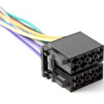 A black 8-cavity connector sits on a white surface with purple, orange, white, blue, red, green, and yellow wires.