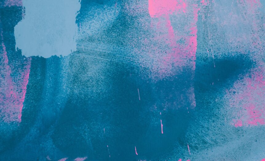 An abstract art piece that focuses primarily on streaks of dark blue with splatters of bright pink. There's no clear subject.