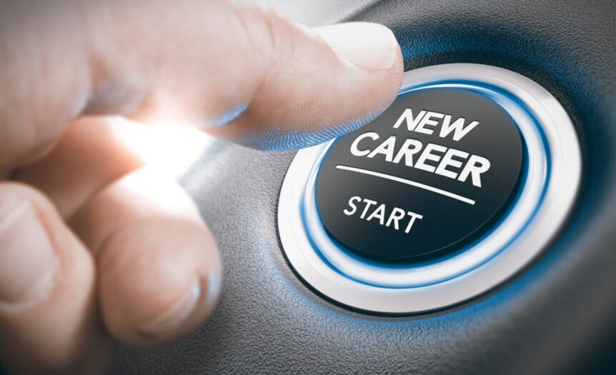 Close-up of a person's hand reaching over with their thumb to hit a glowing button labeled "New Career -- Start."